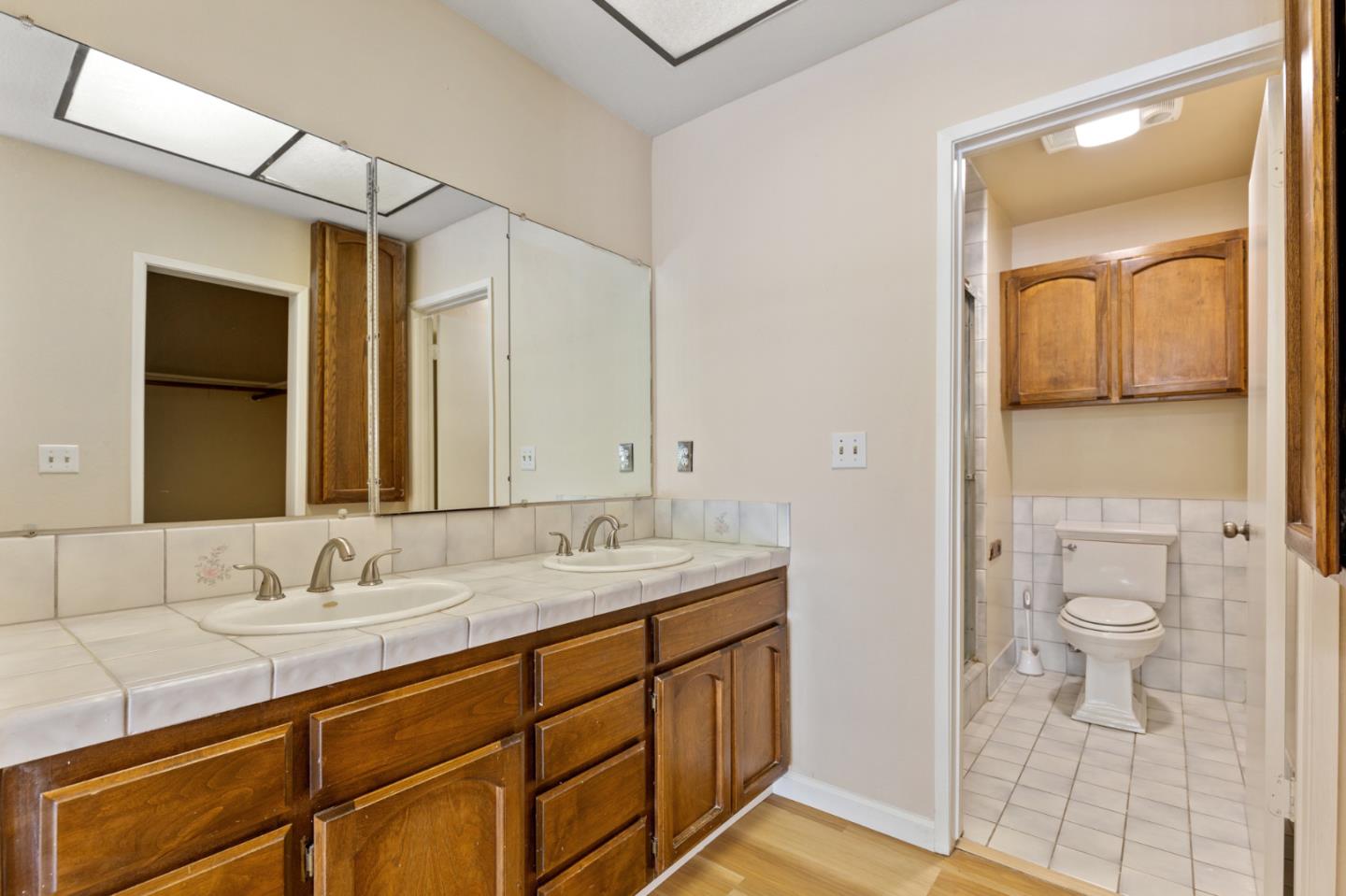 7034 Vía Pradera San Jose, CA 95139 - Photo 23 of 31 a bathroom with a sink a toilet and shower