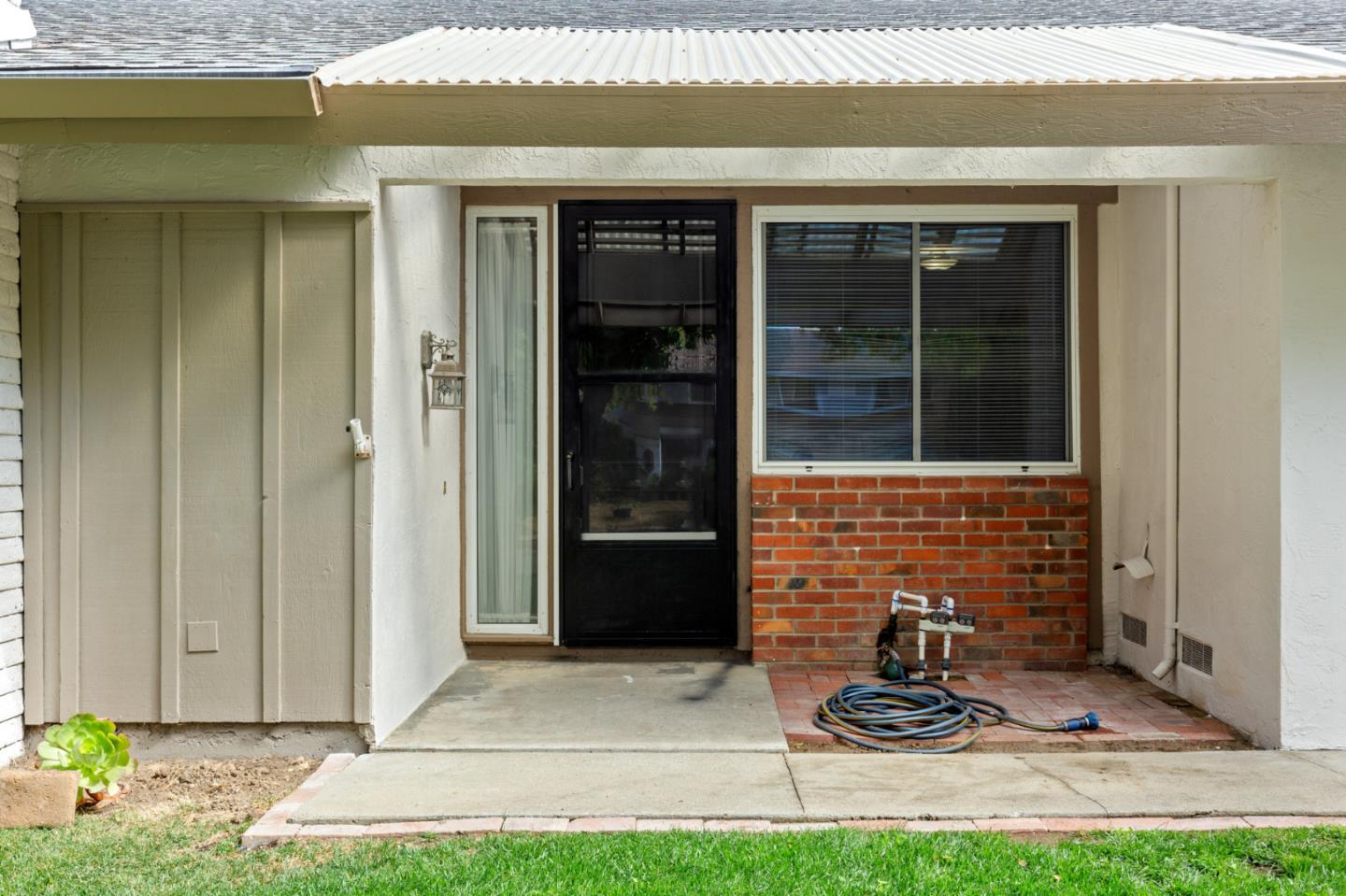 7034 Vía Pradera San Jose, CA 95139 - Photo 4 of 31 a front view of a house with garden