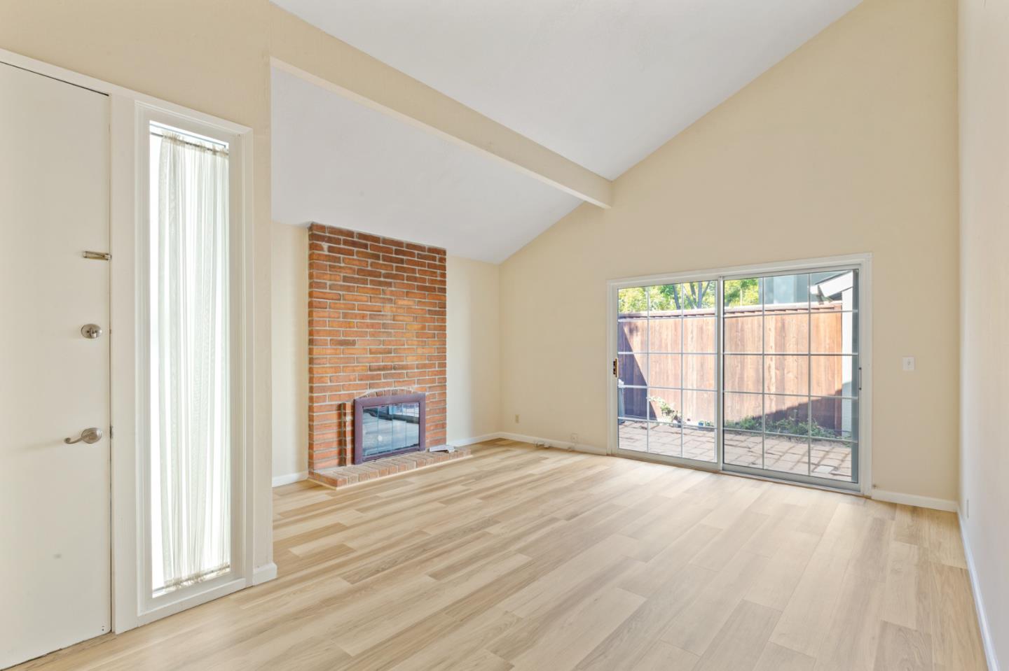 7034 Vía Pradera San Jose, CA 95139 - Photo 6 of 31 an empty room with wooden floor and windows