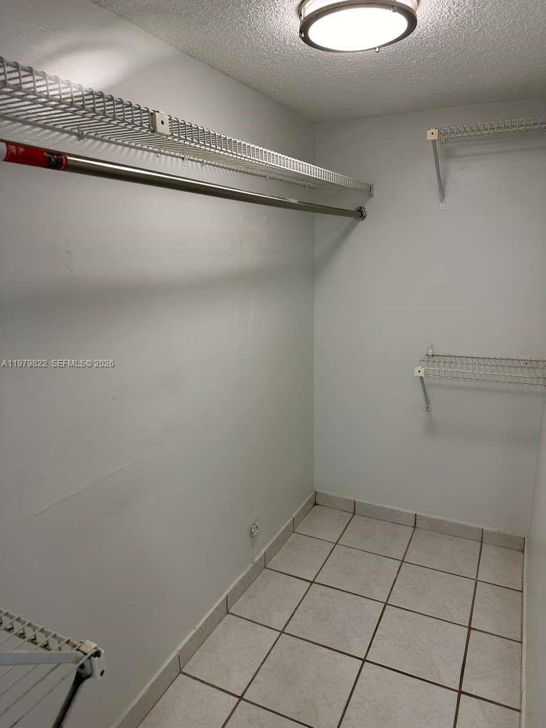 7355 West 4th Avenue, Unit 216 Hialeah, FL 33014 - Photo 4 of 7 a view of a room with racks on the wall