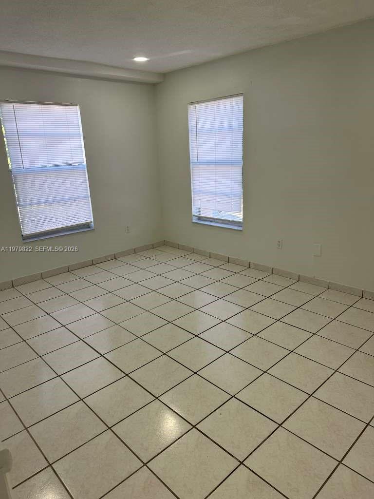 7355 West 4th Avenue, Unit 216 Hialeah, FL 33014 - Photo 6 of 7 a view of an empty room and window