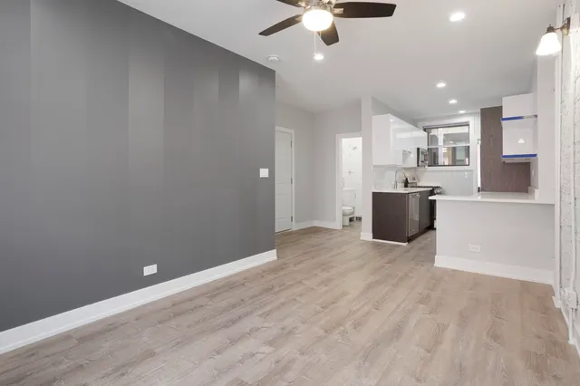 a kitchen with stainless steel appliances a sink stove and microwave