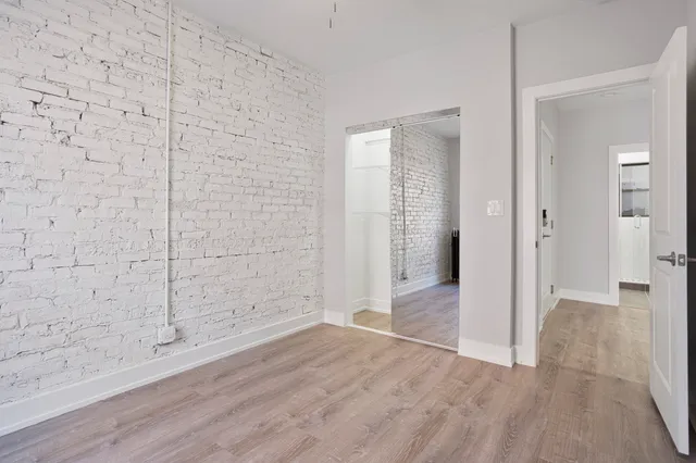 a bathroom with a toilet a sink a mirror a vanity and vanity