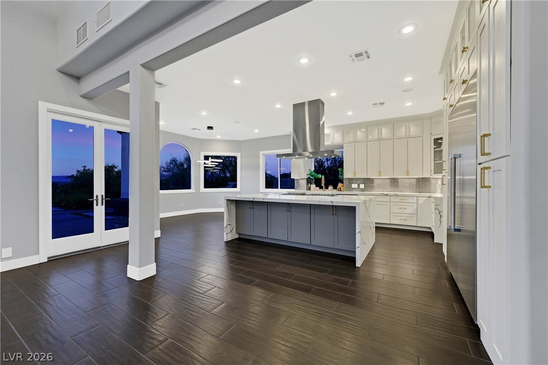 6 Rue Du Ville Henderson, NV 89011 - Photo 33 of 99 This spacious kitchen offers a large island, sleek appliances, and expansive windows for abundant light.