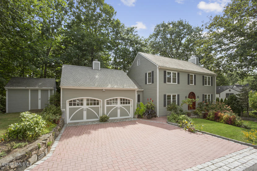 front view of a house with a garden