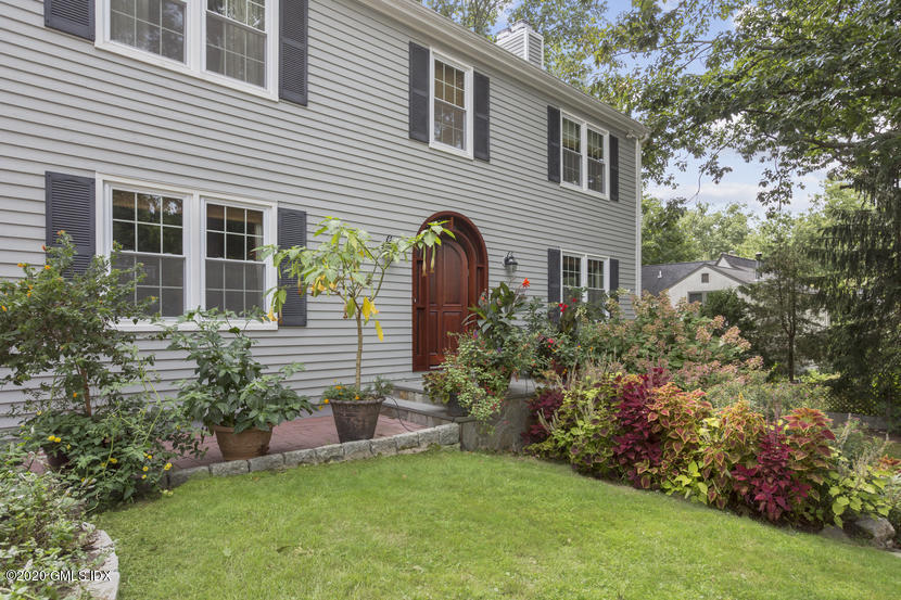 2 Ridge Road Cos Cob, CT 06807 - Photo 3 of 28 a front view of a house with a garden