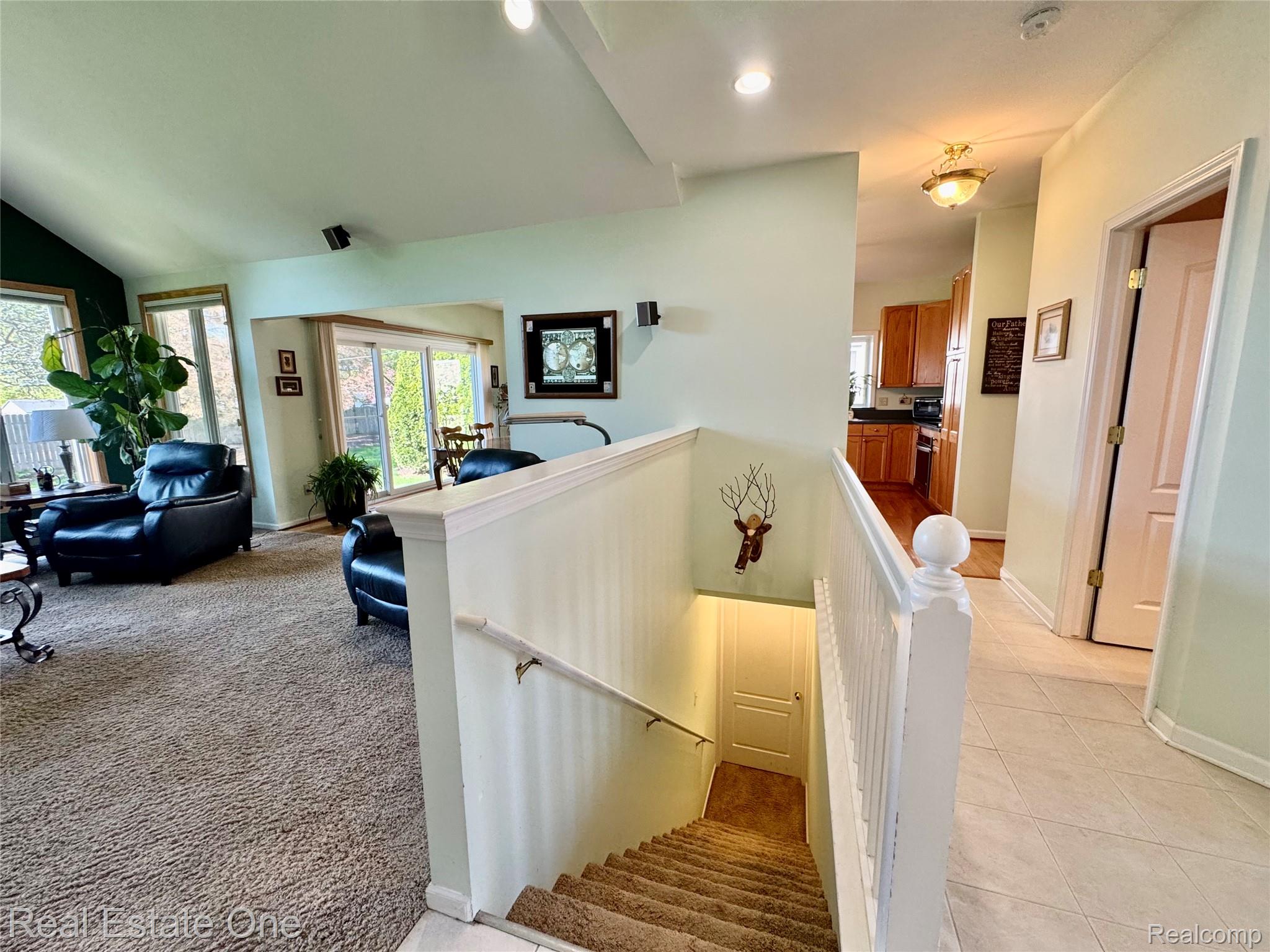 1668 South Shore Drive Rochester, MI 48307 - Photo 21 of 27 Staircase featuring tile patterned flooring and recessed lighting