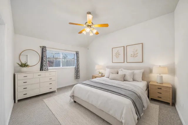 a bedroom with a bed and a dresser