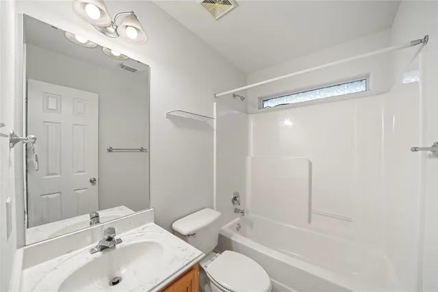a bathroom with a sink shower bathtub and a toilet