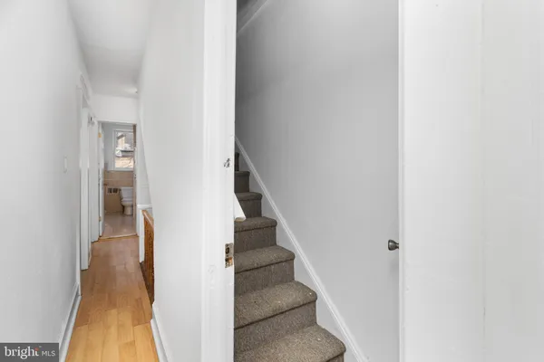 a view of a hallway with staircase