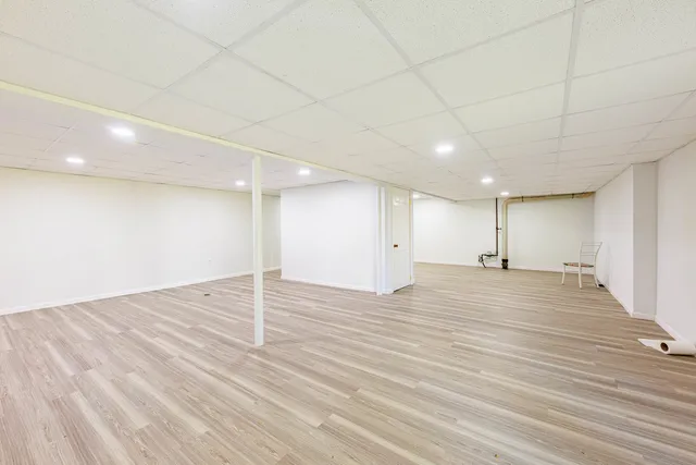an empty room with wooden floor