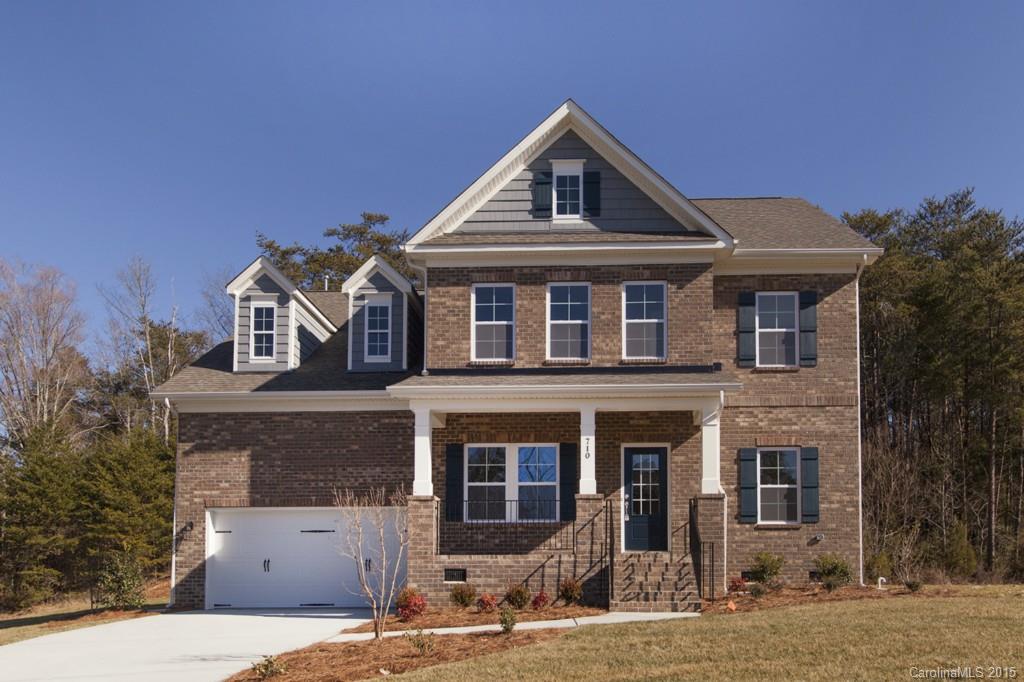 710 Old Cove Road, Unit 42 Tega Cay, SC 29708 - Photo 1 of 23 a front view of a house with a yard