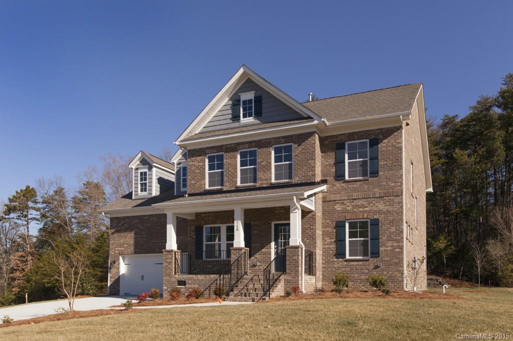 710 Old Cove Road, Unit 42 Tega Cay, SC 29708 - Photo 2 of 23 a front view of a house with a yard