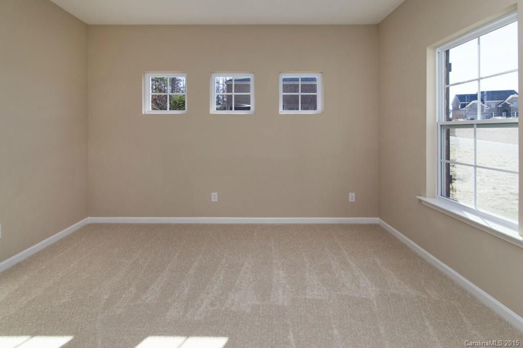 710 Old Cove Road, Unit 42 Tega Cay, SC 29708 - Photo 11 of 23 an empty room with windows