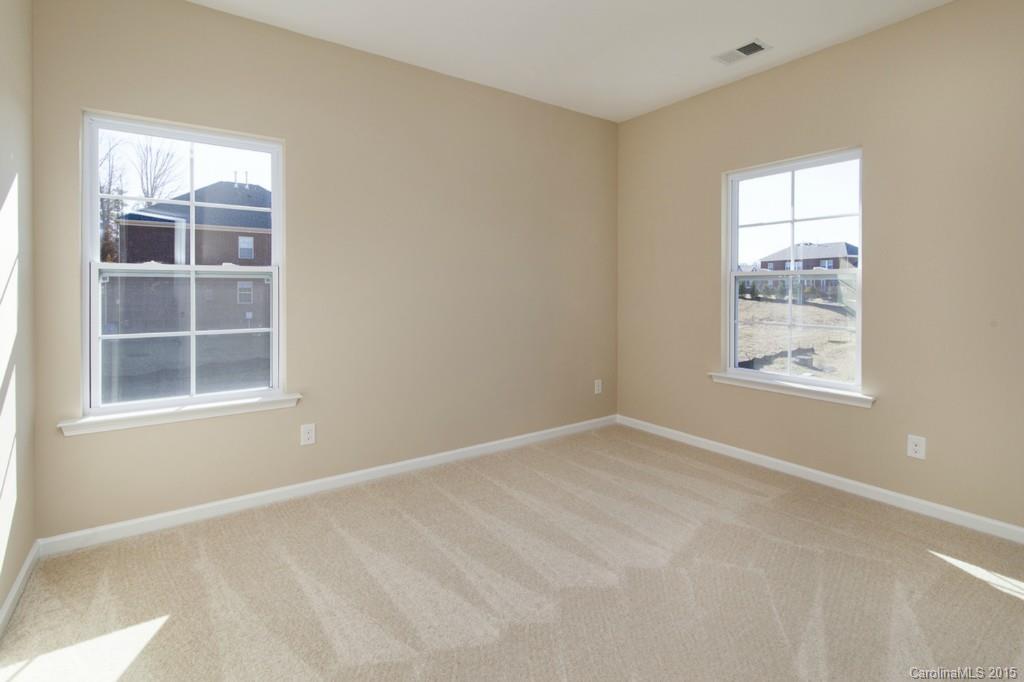 710 Old Cove Road, Unit 42 Tega Cay, SC 29708 - Photo 16 of 23 an empty room with windows