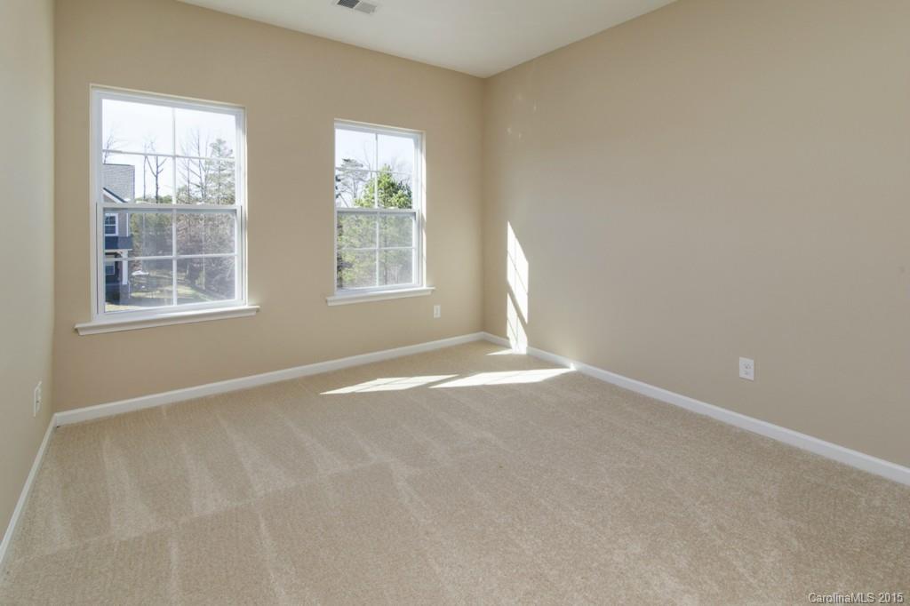 710 Old Cove Road, Unit 42 Tega Cay, SC 29708 - Photo 17 of 23 an empty room with windows