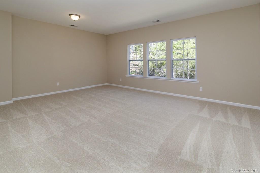 710 Old Cove Road, Unit 42 Tega Cay, SC 29708 - Photo 19 of 23 an empty room with a window