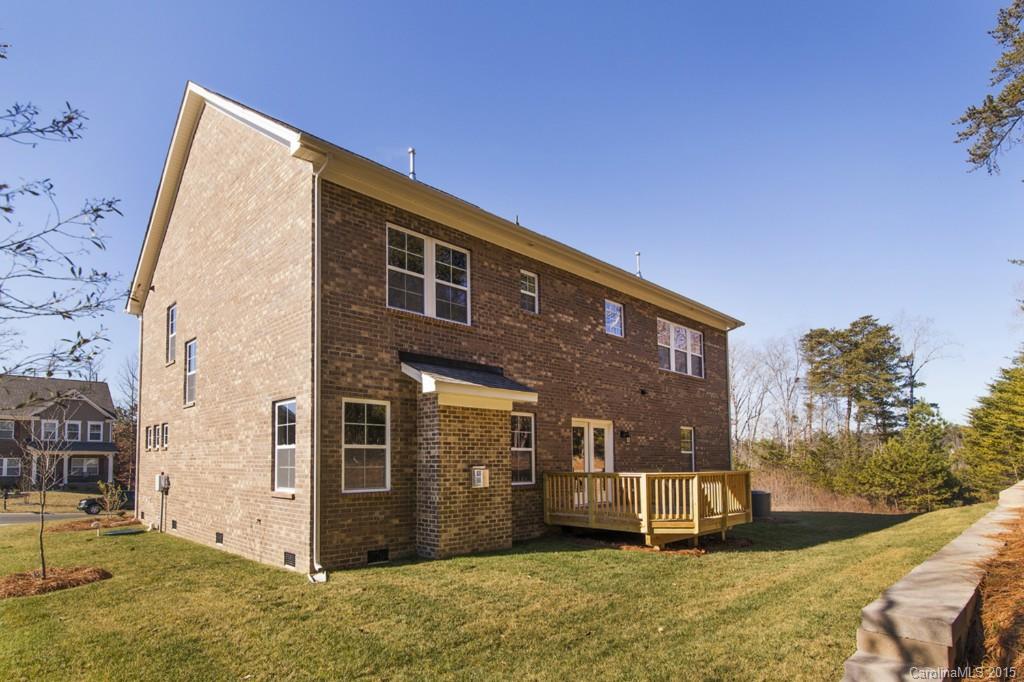710 Old Cove Road, Unit 42 Tega Cay, SC 29708 - Photo 20 of 23 a view of a house with backyard