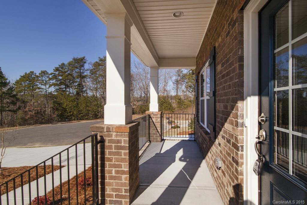 710 Old Cove Road, Unit 42 Tega Cay, SC 29708 - Photo 3 of 23 a view of balcony with wooden floor and fence