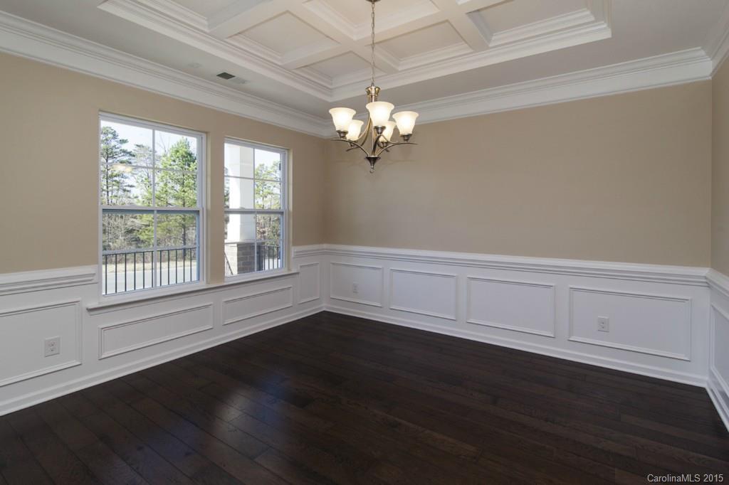 710 Old Cove Road, Unit 42 Tega Cay, SC 29708 - Photo 10 of 23 a view of a room with wooden floor and a window