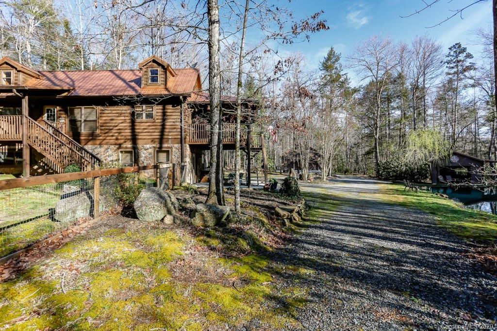 997 Proctor Road Lake Lure, NC 28746 - Photo 3 of 40 a view of a house with a yard