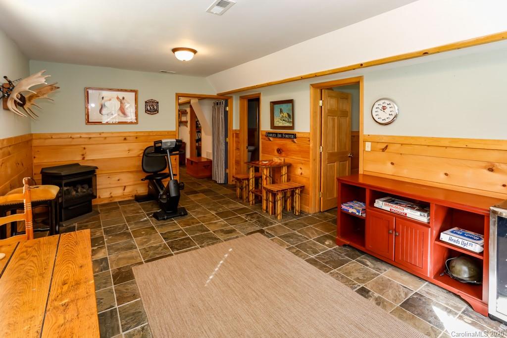 997 Proctor Road Lake Lure, NC 28746 - Photo 21 of 40 a bedroom with furniture and a dresser