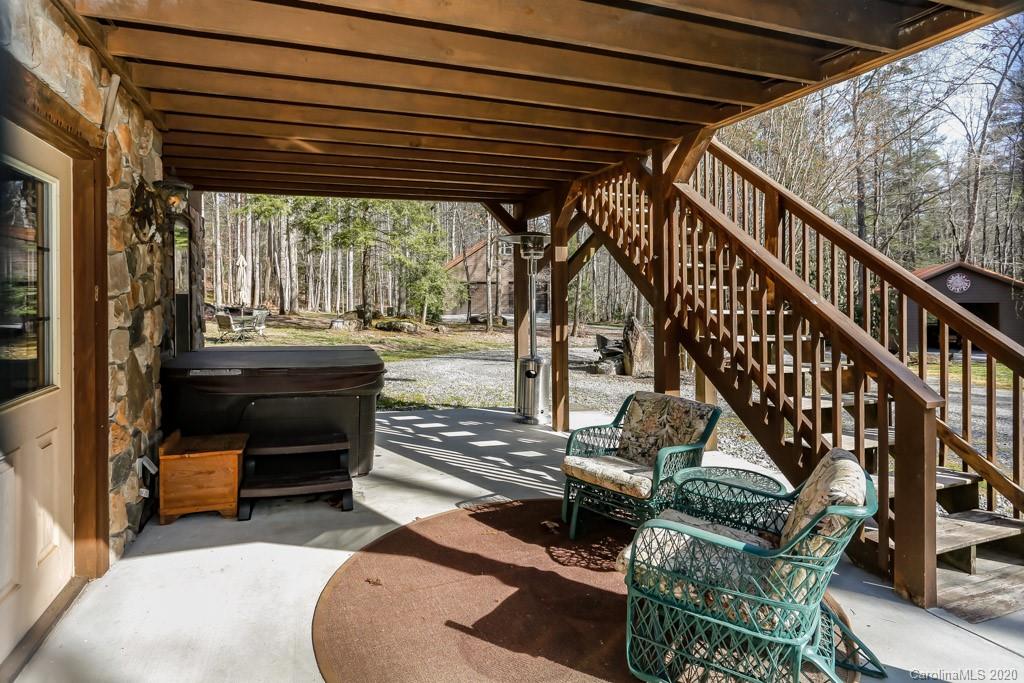 997 Proctor Road Lake Lure, NC 28746 - Photo 23 of 40 a balcony with furniture and a potted plant