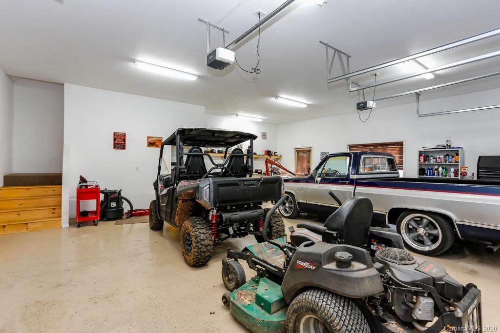 997 Proctor Road Lake Lure, NC 28746 - Photo 24 of 40 a bedroom with furniture and a view