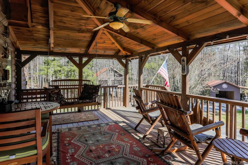 997 Proctor Road Lake Lure, NC 28746 - Photo 27 of 40 a view of a chairs and table in the patio