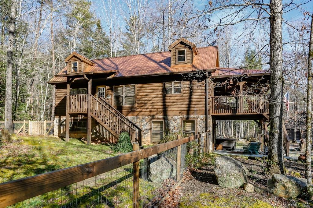997 Proctor Road Lake Lure, NC 28746 - Photo 29 of 40 a small house with a tree in front of it