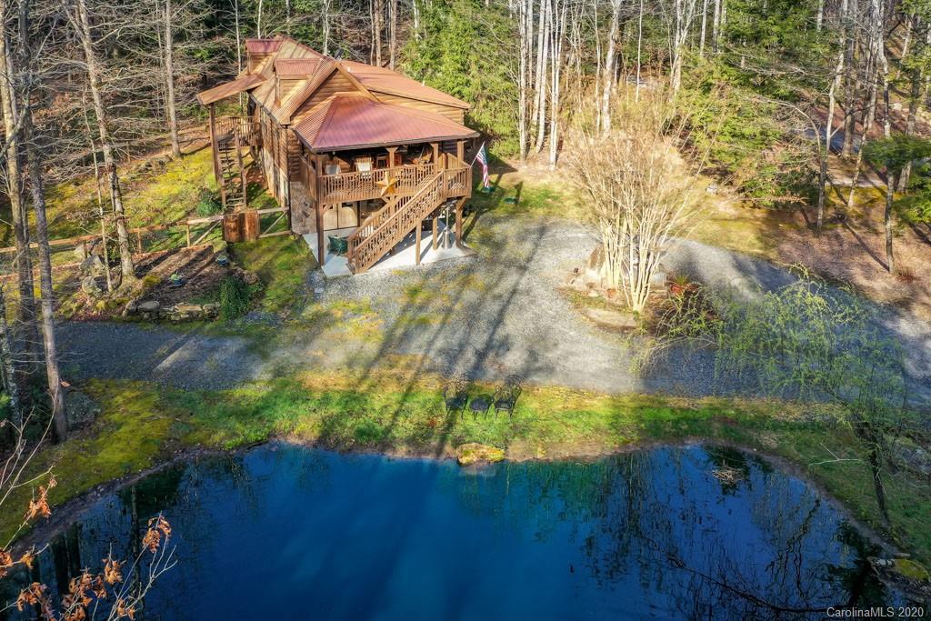 997 Proctor Road Lake Lure, NC 28746 - Photo 38 of 40 a backyard of a house with yard and outdoor seating