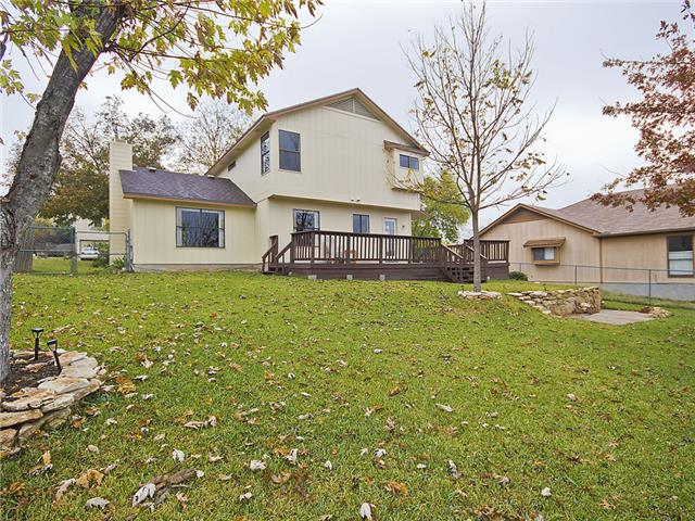 1411 Clearview Loop Round Rock, TX 78664 - Photo 11 of 13 Rear view of property with a deck, a chimney, and a yard