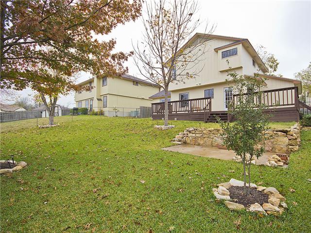 1411 Clearview Loop Round Rock, TX 78664 - Photo 12 of 13 View of yard featuring a deck, fence, and a patio