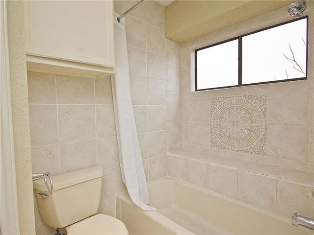 1411 Clearview Loop Round Rock, TX 78664 - Photo 8 of 13 Full bath with toilet and shower / bath combination with curtain