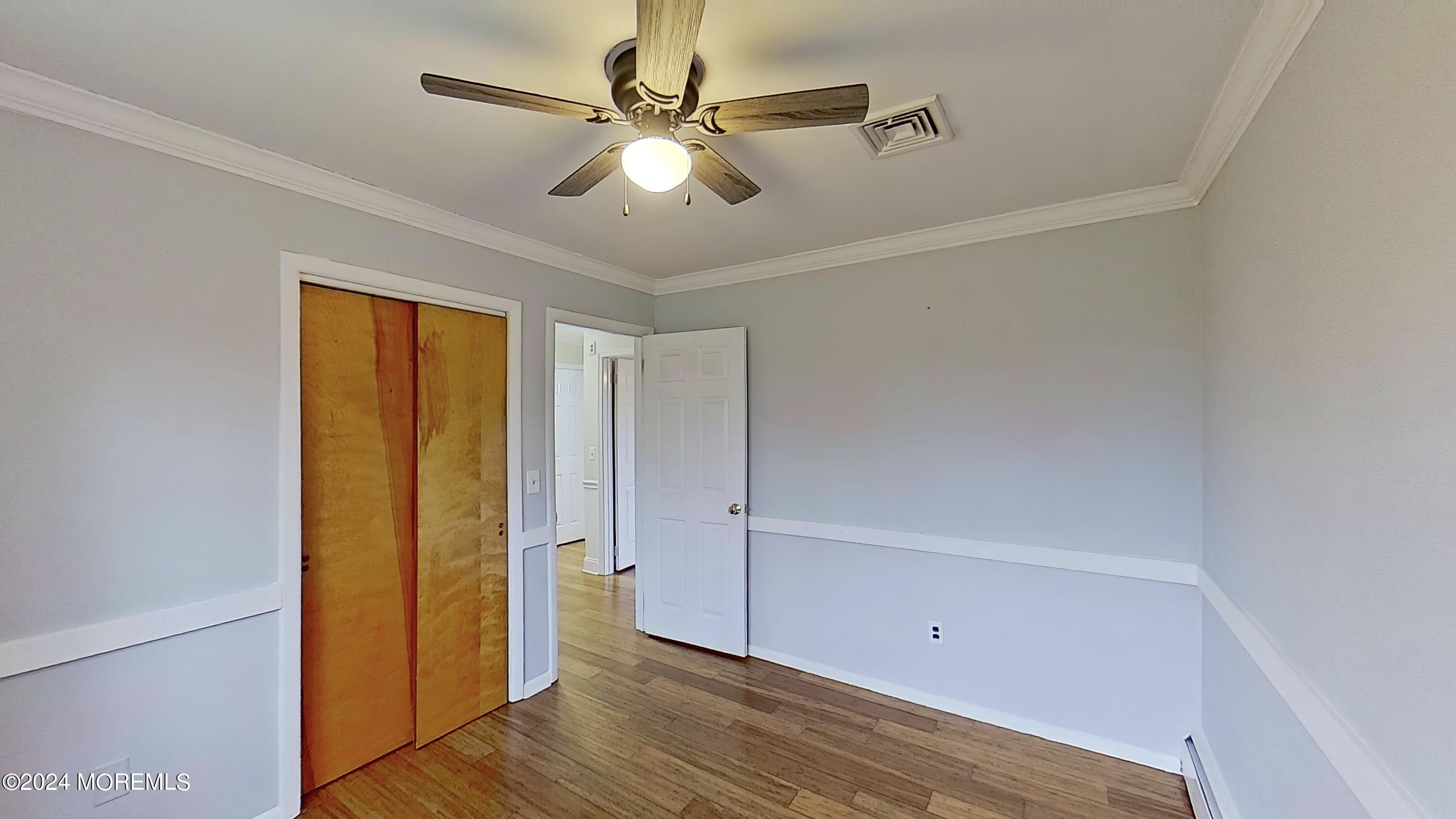 144 Windeler Road Howell, NJ 07731 - Photo 31 of 59 wooden floor in an empty room with a window
