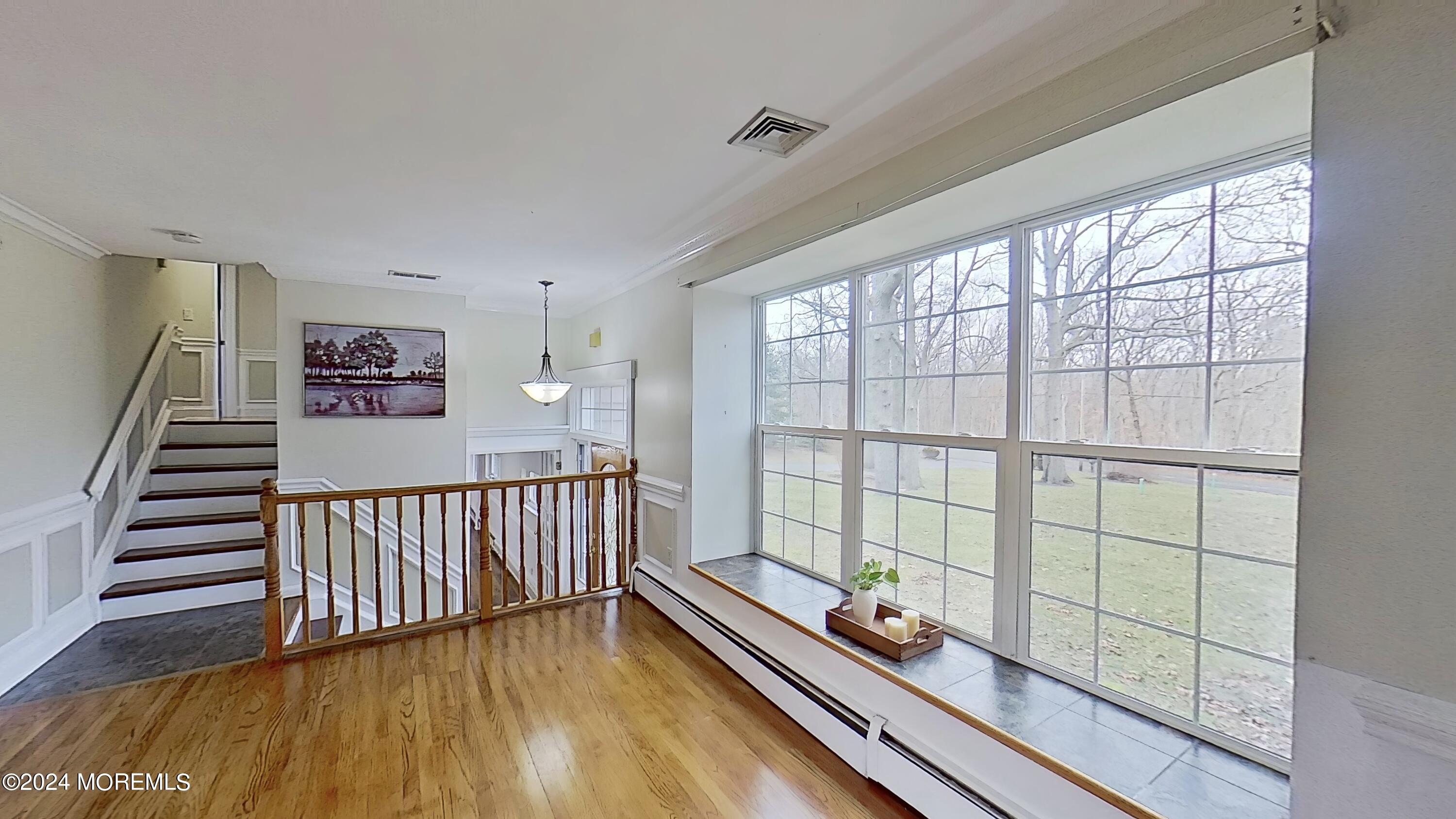 144 Windeler Road Howell, NJ 07731 - Photo 54 of 59 a view of a room with wooden floor and furniture