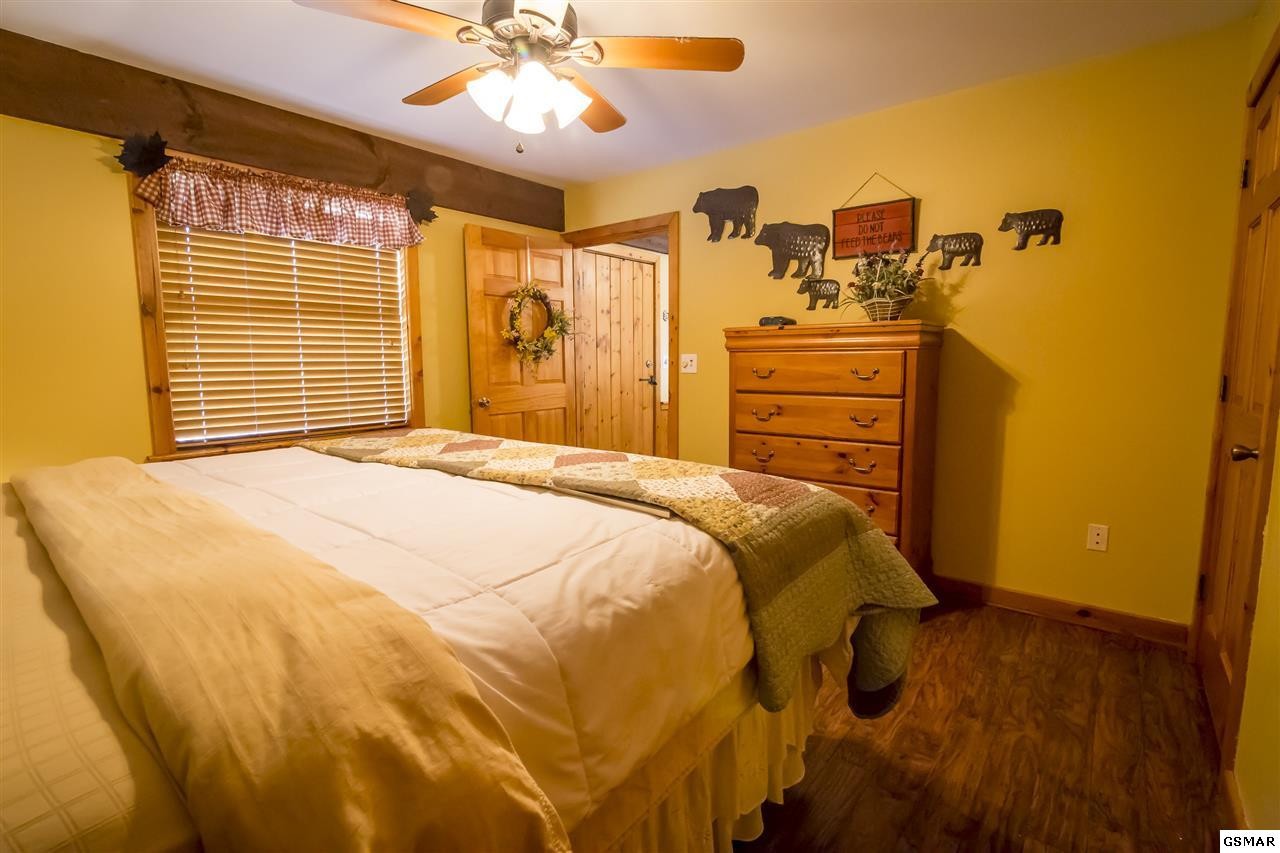 3510 Jakes Ridge Sevierville, TN 37862 - Photo 19 of 29 a bed sitting in a bedroom next to a window