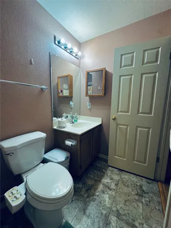 a room with pool table and windows
