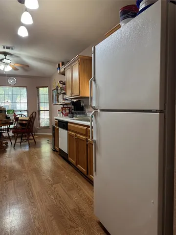 a living room with pool table and a flat screen tv