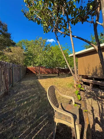 a view of a car parked on the side of a street