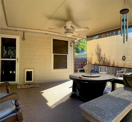a room with pool table and windows