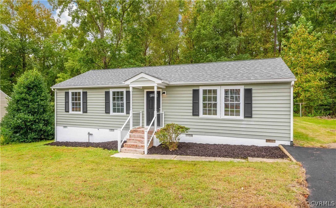 View of front of house with a front lawn