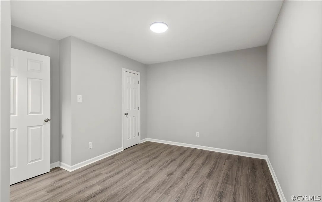 16216 Mistora Road Chester, VA 23831 - Photo 17 of 17 Unfurnished bedroom featuring a closet and wood-ty