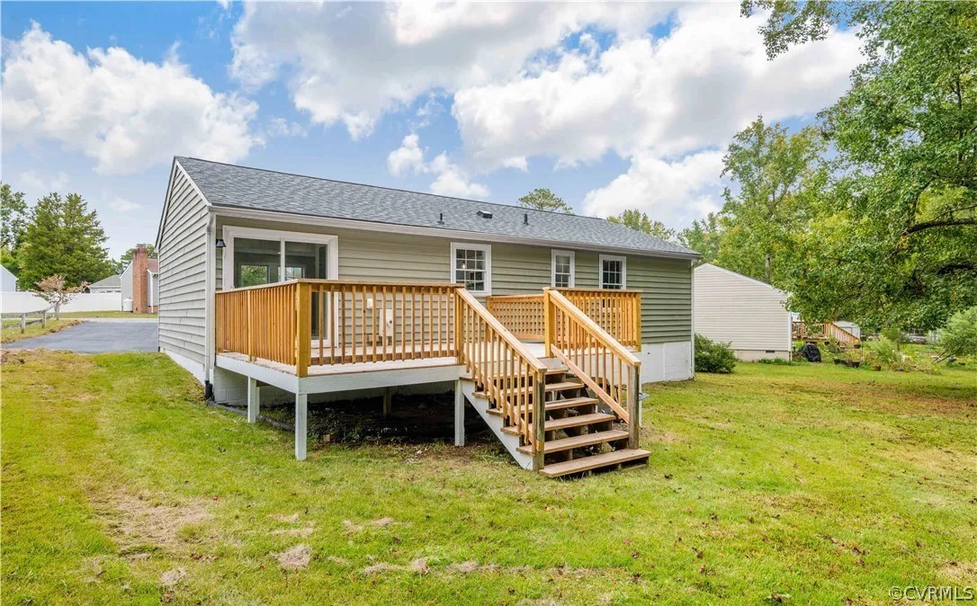 16216 Mistora Road Chester, VA 23831 - Photo 8 of 17 Rear view of property featuring a lawn and a woode
