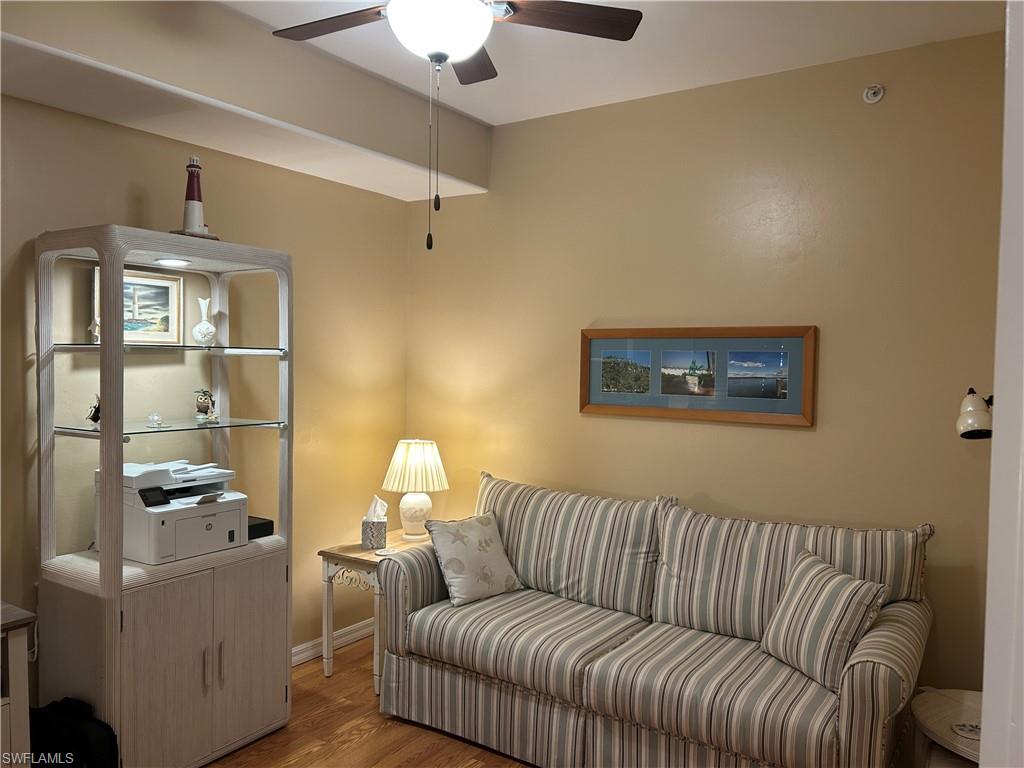 1390 Tiffany Lane, Unit 2302 Naples, FL 34105 - Photo 22 of 37 a living room with furniture and a window