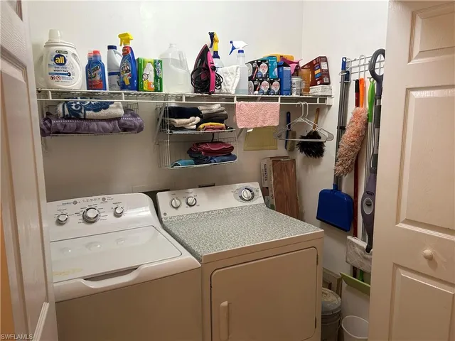 a view of storage and utility room with washer and dryer