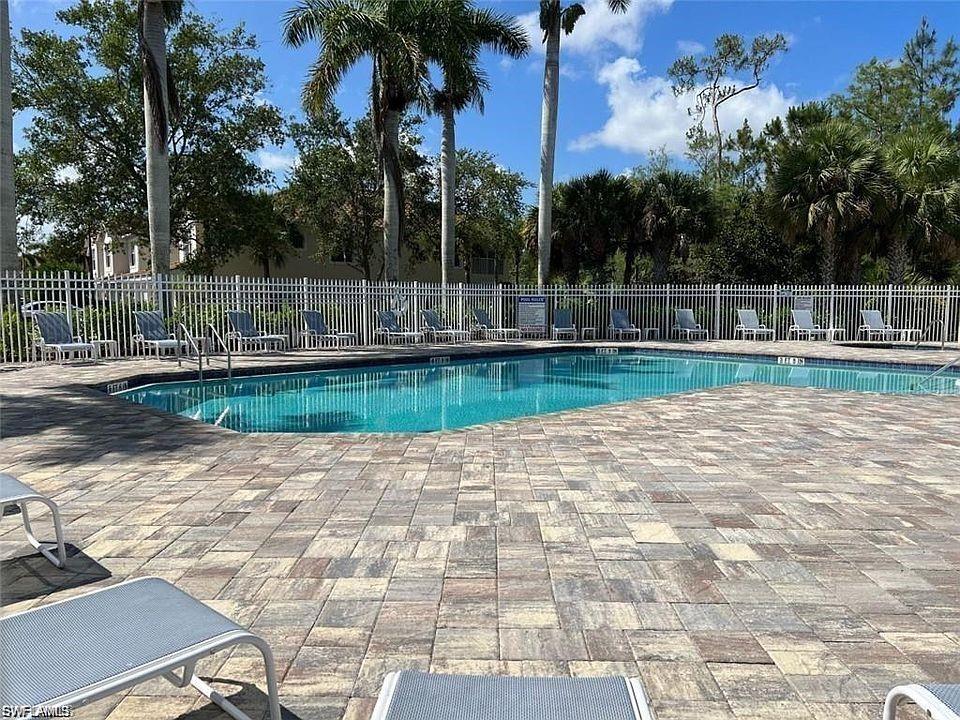1390 Tiffany Lane, Unit 2302 Naples, FL 34105 - Photo 35 of 37 a view of a backyard