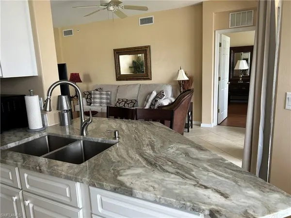 a kitchen with a sink and a refrigerator