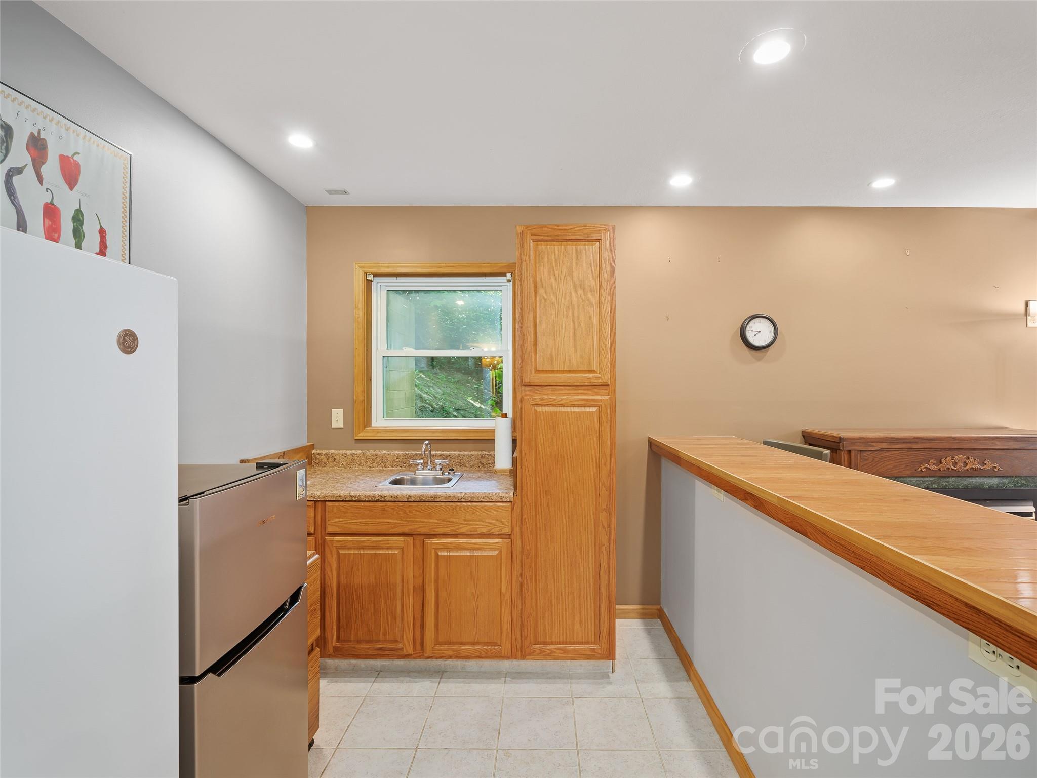 142 Wildflower Road Spruce Pine, NC 28777 - Photo 25 of 46 a room with a sink and cabinets