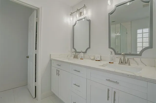 a bathroom with a sink and a shower